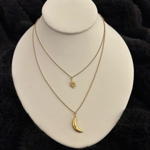 Logan Hollowell layered gold necklace with star and moon pendants